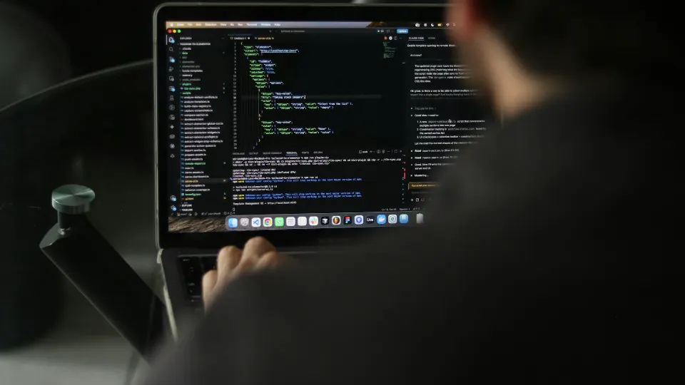 Developer preparing structured output from a laptop