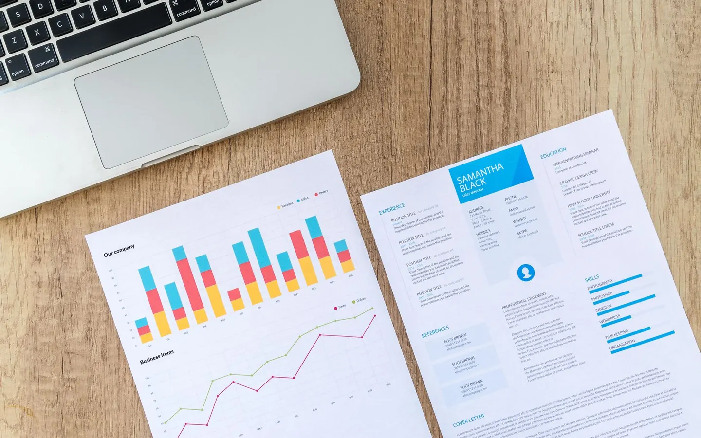 Business dashboard with charts, documents and usage planning on a desk