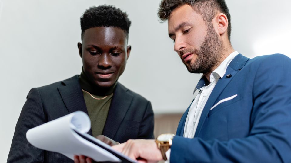 Office workers reviewing professional documents