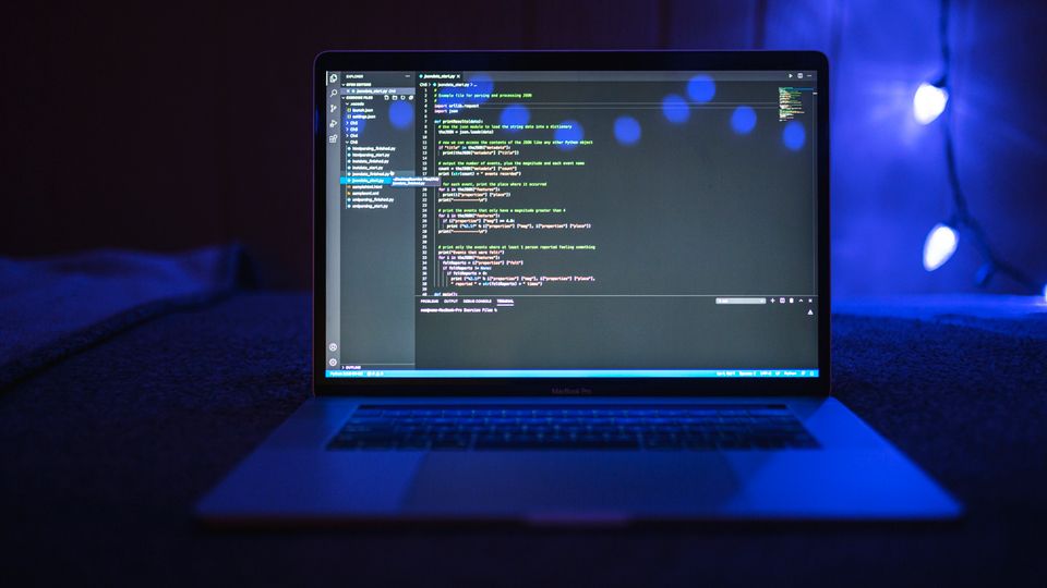 Laptop screen with programming code