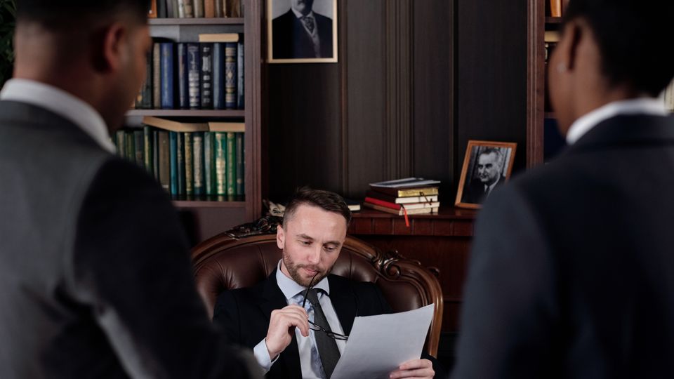 Professionals discussing legal documents in an office