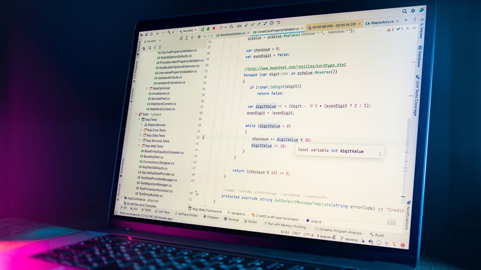 Laptop with code editor for data reporting feed
