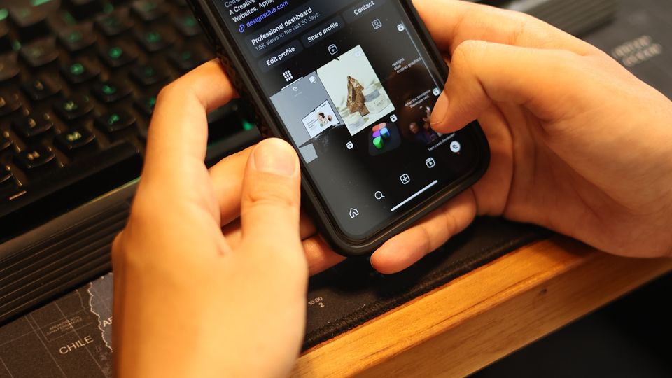 Person browsing a social media app on a smartphone